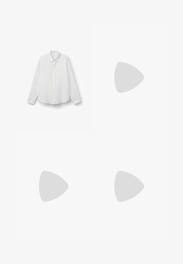 Camicia bianca a maniche lunghe con colletto classico, chiusura con bottoni e vestibilità comoda. Realizzata in un tessuto leggero con una superficie liscia.; Pantaloni corti beige chiari con vita alta, fronte plissettato e due bottoni neri in vita. Tessuto morbido e design informale.; Stivaletto in pelle nera con pannelli laterali elastici, suola in gomma spessa e tacco alto a blocco. Presenta un manico sul retro.; Borsa nera con forma strutturata, texture liscia e una chiusura metallica. Abbinata a pantaloni neri larghi e sandali open-toe su un pavimento in legno.