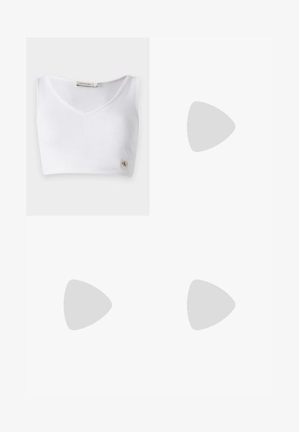White ribbed bralette featuring a V-neckline, wide shoulder straps, and a small logo tag at the hem. Made from a soft, stretchy fabric.; Black flared pants featuring a smooth texture, tailored waistband, and front pockets, designed with a sleek, modern silhouette.; Black leather loafers with a chunky sole, featuring a gold-tone accent on the front and a smooth finish. Chunky tread design on the sole.; Black leather clutch bag with a gold chain strap, featuring a smooth texture, rectangular shape, and embossed branding on the front.