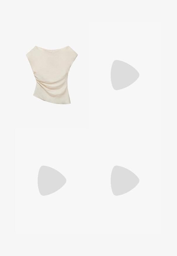 Cream-colored top with a textured, ribbed surface, featuring an asymmetric design and wide, draped shoulders.; Beige pleated shorts with a tailored design, featuring a high waist and smooth texture. Four front pleats create volume. No pockets.; White flat shoe featuring a mesh design with a pointed toe and a low, flat sole. Textured upper with a smooth lining and subtle contrast trim.; Brown leather hobo bag with a rounded shape, featuring a gold hardware accent and contrast stitching. Paired with a denim shirt and jeans.