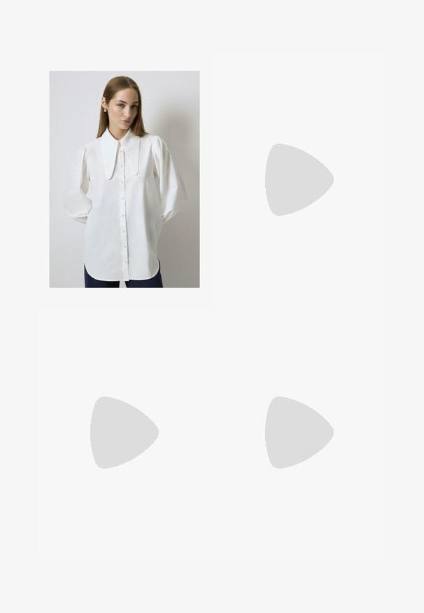 Blouse blanche à manches longues avec un grand col plat, des boutons à l'avant et une coupe ample. Tissu lisse avec un léger éclat, manches froncées.; Jeans larges bleu marine à taille haute, dotés de cinq poches, d'une fermeture par bouton et zip, et de bas de pantalon repliés. Texturé denim classique.; Des escarpins slingback beiges avec un bout pointu et un talon évasé bas. Fabriqués en cuir lisse avec un design minimaliste et une sangle réglable.; Collier en or composé de maillons ovales entrelacés, d'une surface texturée et d'un fermoir avec un petit accent rond et une chaîne d'extension.