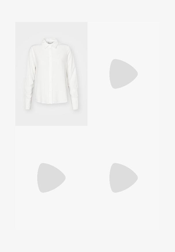 Camisa blanca de manga larga con cuello, hecha de tela suave; presenta un corte recto y una textura sutil.; Jeans de mezclilla oscuros de tiro alto y pierna ancha, con bolsillos delanteros y traseros, cierre de botón y detalles de costura visibles.; Zapatillas blancas de felpa con un diseño bordado de cereza en rojo y verde. Textura suave con estilo fácil de poner.; Gafas rectangulares con un delgado marco de metal en color oro rosa. Lentes transparentes, puntas de las patillas transparentes y un delicado detalle alrededor de las lentes.