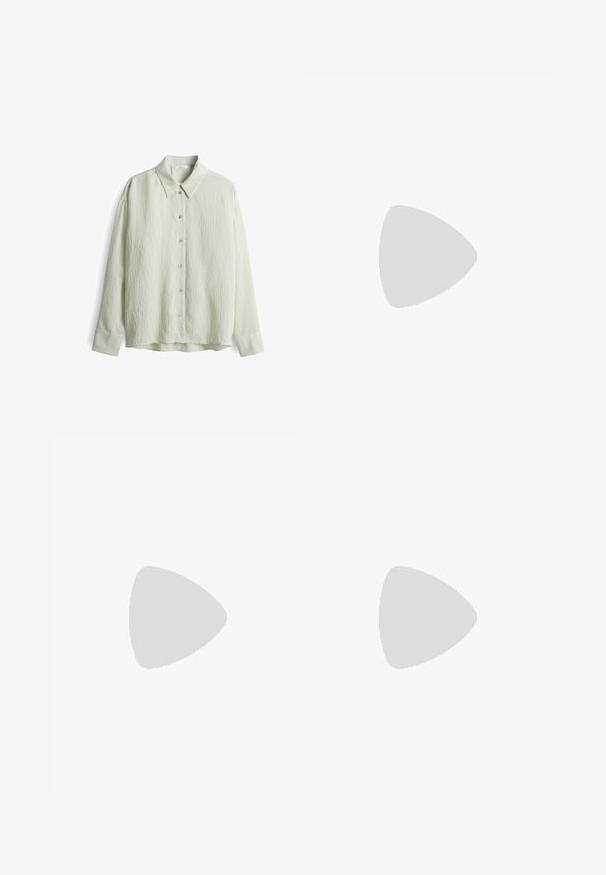 Camicia a maniche lunghe verde chiaro con colletto, caratterizzata da una superficie testurizzata, chiusura frontale con bottoni e un sottile motivo a righe sui polsini.; Pantaloni neri a gamba larga, realizzati in morbido tessuto, con vita elastica e texture liscia. Nessun motivo o dettaglio visibile.; Sneaker alte bianche con tomaia in canvas testurizzato, punta in gomma e suola platform spessa bianca. Presenta dettagli e occhielli neri.; Occhiali da sole neri rettangolari con lenti scure e montatura spessa opaca. Le asticelle sono leggermente affusolate con una texture liscia.