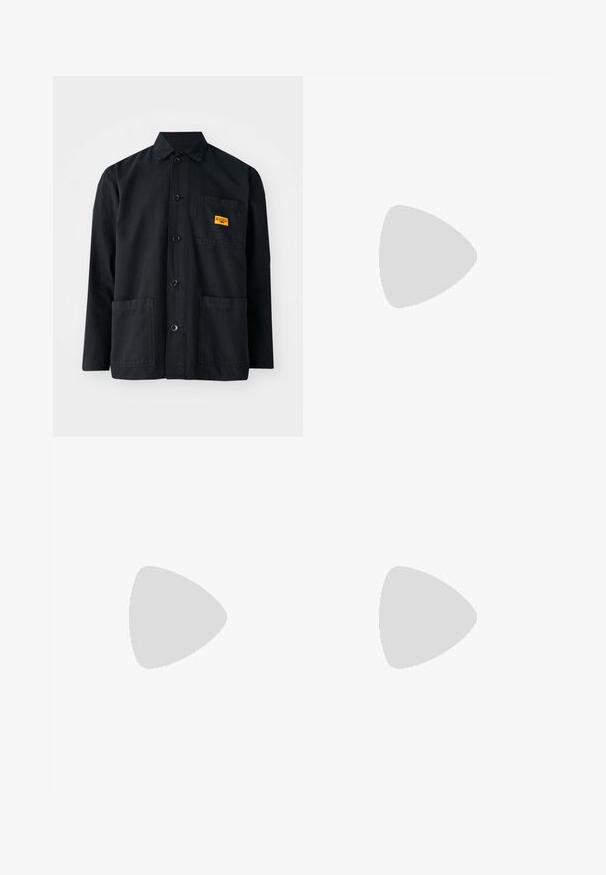 Black cotton work jacket with a button front, two front pockets, and a small yellow label on the chest pocket. Simple, utilitarian design.; Black cotton t-shirt with short sleeves, crew neck, and a small yellow logo on the left chest area. Simple design and regular fit.; Black cargo pants made of a soft fabric, featuring a loose fit, side pockets, and a button closure. The bottom hem is cuffed.; Gray and blue sneaker with a textured upper, featuring mesh and synthetic materials, a chunky sole, and a white and beige accent.