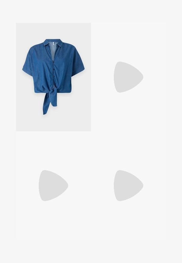 Camisa de ganga azul de mangas curtas com gola, fecho à frente por botões e detalhe de barra atada. Textura suave e design descontraído.; Saia maxi plissada em padrão floral vibrante em vermelho, rosa e castanho. A cintura elástica e a textura suave aumentam o conforto e o estilo.; Sapatilha de couro branca com biqueira perfurada, sola texturizada e atacadores brancos, combinada com calças largas vermelhas e um fundo azul e amarelo.; Bolsa de mão em couro vermelho com um design angular e geométrico. Apresenta uma única alça ajustável e um fecho com aba, com detalhes cosidos.