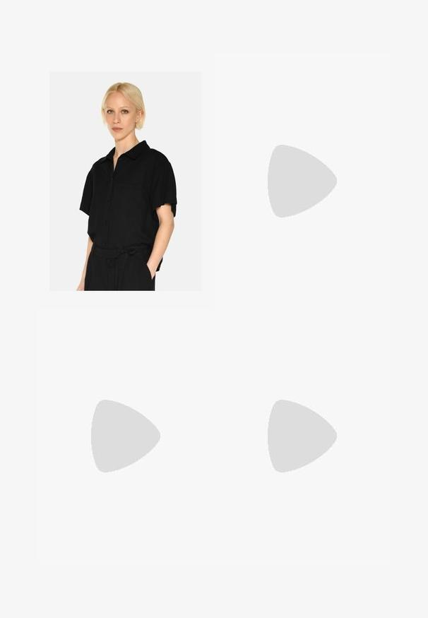 Black short-sleeve button-up shirt with a collar, featuring a chest pocket and soft fabric texture. The design is relaxed and streamlined.; Black denim pants with a straight leg design, five pockets, metal button closure, and subtle stitching details. Smooth texture.; Bershka High heeled sandals - black; Bershka WITH CHAIN - Handbag - black