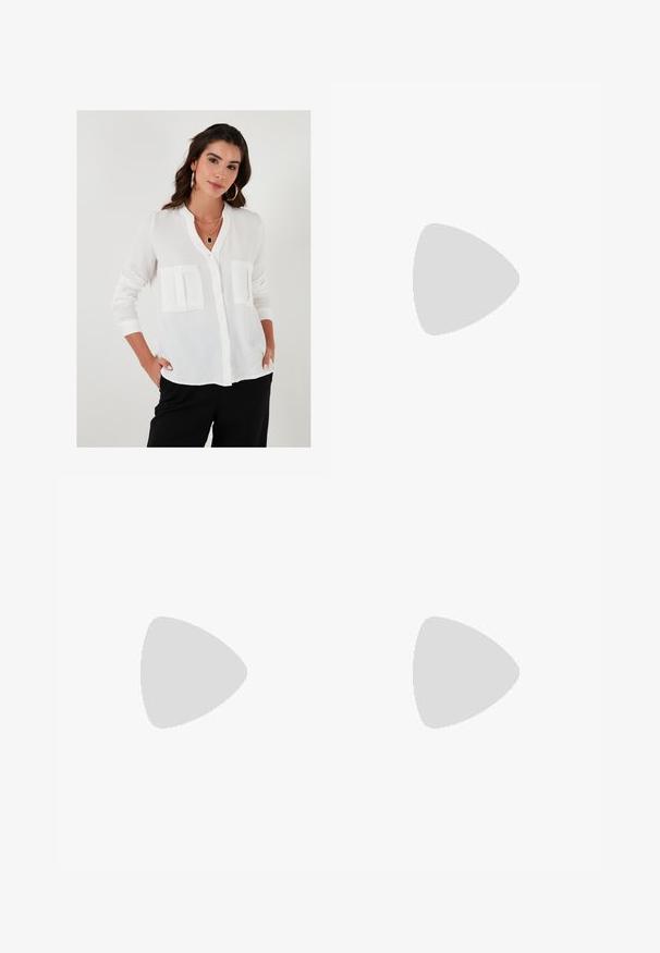 Camicia bianca con colletto alla mandarino, due tasche frontali, maniche lunghe e un tessuto leggero e texturizzato.; Pantaloni a gamba larga in satin color crema con motivi geometrici ricamati in nero lungo l'orlo. Presentano una texture liscia e una silhouette sagomata.; Decolletè beige in pelle con tacco a blocco e punta affusolata, rifinita con un bordo nero lungo l'apertura e una sottile cinturino regolabile sul retro con dettagli in corsa dorati.; Borsa a mano in pelle crema a forma di mezzaluna, con accessori in oro, dettagli neri e una tracolla rimovibile. Presenta una dettagli in catena e un'etichetta.
