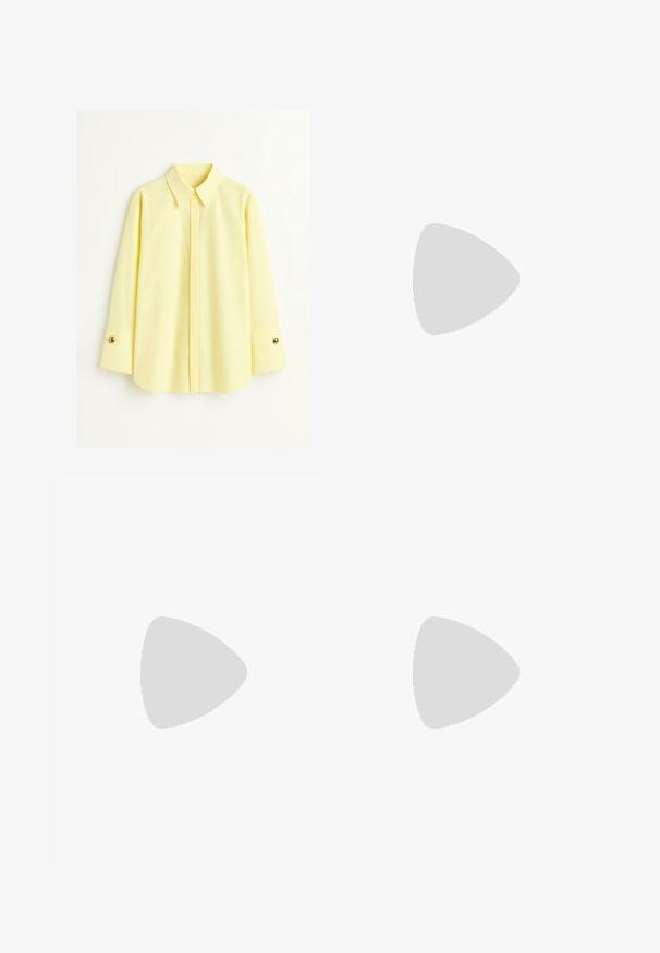 Yellow long-sleeve shirt made of a lightweight fabric. Features a classic collar and gold button detail on the cuffs. Smooth texture.; Black trousers with a straight fit, featuring front pockets and side slits at the hem. Made of soft, smooth fabric. Suitable for various occasions.; Black patent heeled sandals with a square toe, ankle straps, and silver buckles. Features a chunky block heel for stability.; Black leather handbag with a curved shape, detachable strap, and gold hardware. The bag features a flap with a buckle detail.