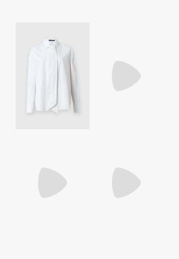 White button-up shirt with long sleeves, featuring a large bow at the collar, made from smooth fabric with a crisp texture.; Black trousers featuring a straight cut, smooth texture, and a waistband with a single button closure. No visible patterns or accents.; Black leather high-heeled shoe with pointed toe, ankle strap, and a thin heel. Smooth texture with a gold accent on the heel base.; Beige leather handbag with a structured, triangular shape, featuring a silver chain handle and a cursive logo in metal.