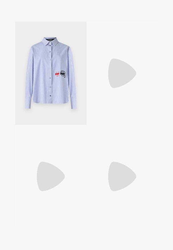Blue and white striped button-up shirt with long sleeves, featuring red and black embroidered accents of a cat and sunglasses.; Light blue, wide-leg jeans made of denim. Features a button and zip closure, front pockets, and subtle fading. Clean hems.; White canvas sneakers with a ribbed platform sole, featuring silver "Karl" embroidery on the side and lace-up closure.; Black and white striped handbag with a structured shape, featuring a top handle, a detachable chain strap, and metallic logo accent.