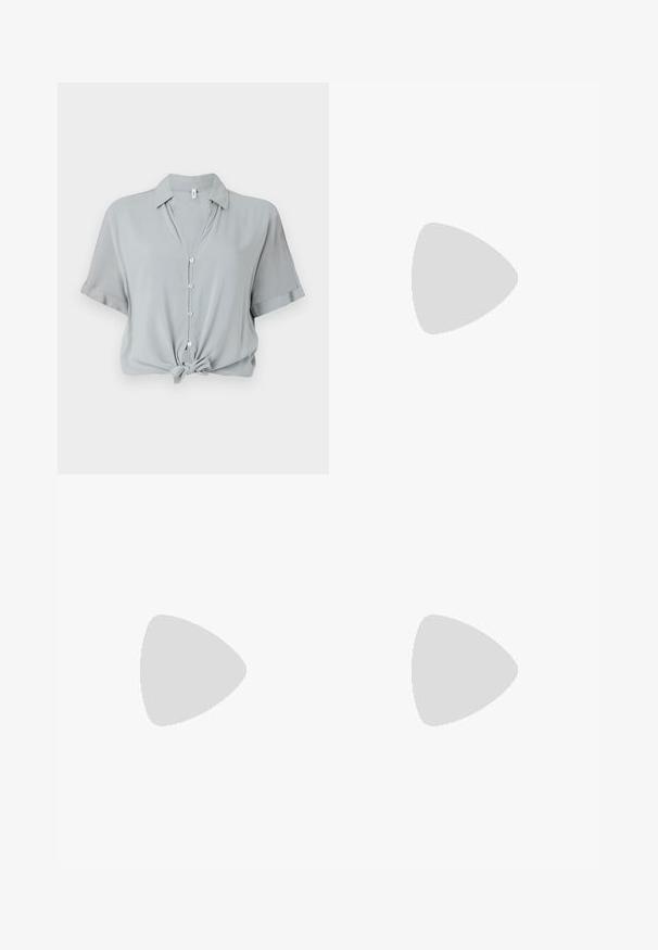 Light gray, short-sleeve shirt with a collar, front buttons, and a knotted hem. Made from a smooth, soft fabric.; Classic blue denim jeans with a straight-leg design, five pockets, and a button closure. Features a medium wash and sturdy texture.; Black patent leather pointed-toe shoes with a block heel and ankle strap, paired with gray ribbed leg warmers and a brown suede skirt.; Black faux leather handbag with a crocodile texture, cinched top, and a scrunched strap. Appears soft and compact in design.