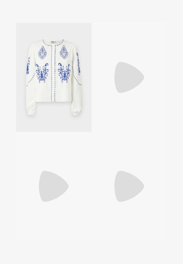 Witte blouse met blauwe borduursels in bloempatroon, een kleine kraag, knopen aan de voorkant en lange mouwen met geplooide manchetten.; Donkerblauwe denim bermuda shorts met een trekkoord in de taille, voorzien van standaard riemlussen en zichtbare stikseldetails.; Witte high-top canvas sneakers met een zwarte rubberen zool, een rubberen neuskap aan de voorkant en zes gaatjes voor veters, met een schone, minimalistische uitstraling.; Rode leren handtas met een hoekig, geometrisch ontwerp. Beschikt over een enkele verstelbare schouderriem en een klepclosure met gestikte details.