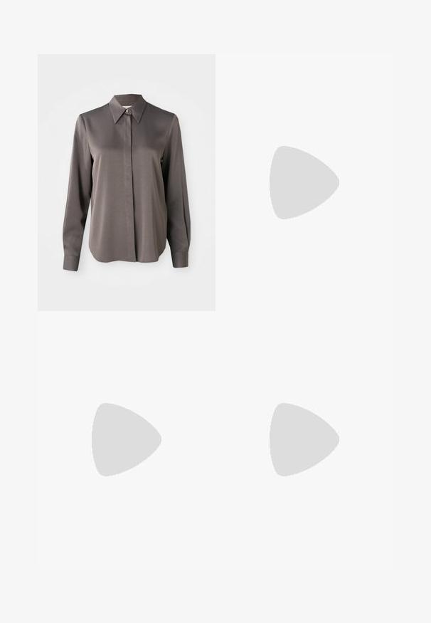 Long-sleeve gray blouse featuring a smooth, satin-like texture, a pointed collar, and a front button closure.; Wide-leg trousers in a mustard yellow fabric, featuring front pockets and a smooth texture, with a clean, tailored design.; Black knee-high leather boot with a low heel and rounded toe, showing stitching details along the shaft and vamp.; Black crocodile-embossed leather handbag with a structured design, top handle, adjustable strap, and a prominent front logo detail.