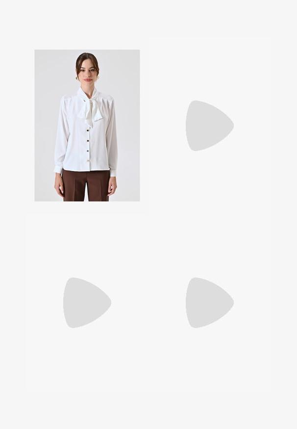 White blouse with a bow tie collar, long sleeves, button-front closure, and subtle sheen. Features light-colored buttons and smooth fabric texture.; Wide-legged trousers in a light cream color. Made from a smooth fabric with pleats at the front and side pockets.; White high-heeled sandal with a chunky heel, featuring a strappy design and ankle tie. Smooth texture with a platform front for added height.; Brown leather crossbody bag with a curved shape, gold hardware, and a buckle accent. Features a detachable shoulder strap.