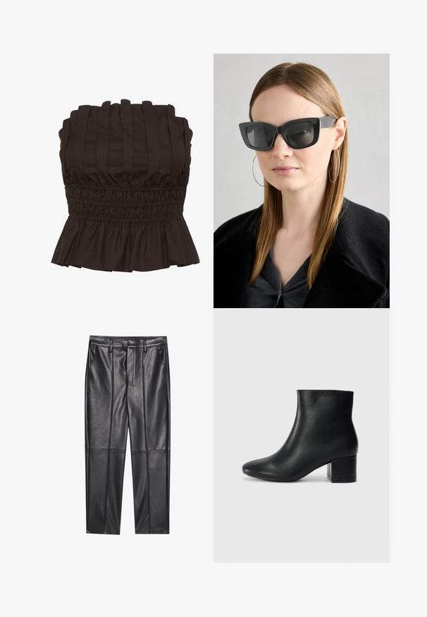 Gestuz PAULINE - Top - dark brown; Sorte læderbukser med en glat overflade, der har lige pasform, to forlommer og synlige sømdetaljer.; Sorte læder ankelstøvler med spids tå og en kraftig hæl. Glat tekstur med minimale detaljer og et slankt, tætsiddende design.; Sorte katteøje solbriller med mørke linser, tykke rammer og subtile detaljer. Båret med en sort frakke og en grå bluse, med langt, glat hår.