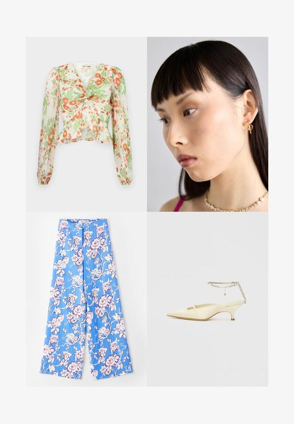 Diane von Furstenberg MARY - Hemdbluse - marlene batik ivory; Blaue Blumenhose mit einem pastellfarbenen Rosenmuster. Der Stoff ist glatt mit einer lockeren Passform, weiten Beinen und einem elastischen Bund.; Spitze, gelbe Satin-Slingback-Schuh mit niedrigem Absatz und einem dekorativen Kettenknöchelriemen mit Strasssteinen. Glatte Textur, minimalistisches Design.; Goldene Creolen, die am rechten Ohr getragen werden, mit einem offenen Design. Das Modell hat glattes, dunkles Haar und ein minimales Makeup.