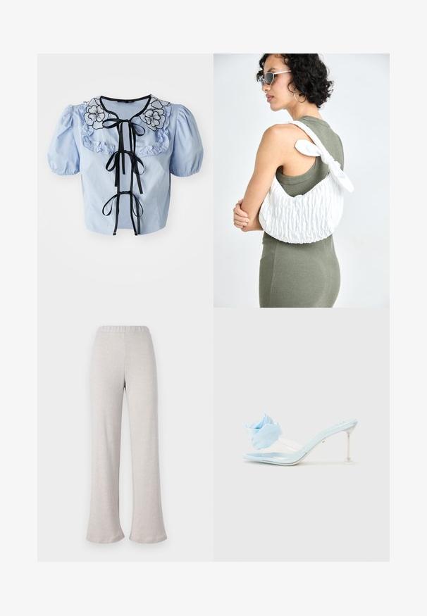 Világoskék, rövid ujjú blúz fodros gallérral, fekete virágmintás hímzéssel és fekete szalagkötőkkel elöl. Simább pamut textúra.; Világos bézs, trapéz szabású nadrág, texturált anyagból készült, rugalmas derékkal és széles lábakkal, kényelmes hétköznapi viselethez.; Kék lakkbőr slip-on szandál átlátszó pánttal, puha kék szövetvirág díszítéssel és áttetsző sarokkal.; Fehér steppelt táska sima textúrával és megkötött masnival, vállon átvetve viselve. Modell olívazöld ruhában, ívelt dekoltázzsal.