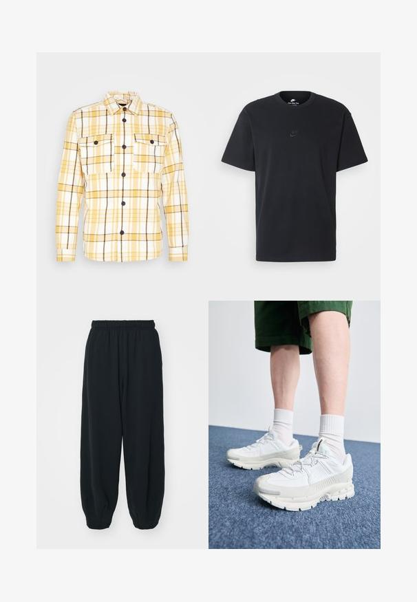 Camicia di flanella a quadri gialli e bianchi con dettagli neri, dotata di colletto, maniche lunghe e due tasche sul petto. Bottoni neri visibili.; T-shirt in cotone nero della Nike con collo rotondo classico, maniche corte e un logo in rilievo discreto sul petto. Texture liscia.; Pantaloni da jogging neri con vita elasticizzata, dalla vestibilità morbida, caviglie a costina, texture liscia e senza motivi visibili o dettagli in metallo.; Scarpe da ginnastica bianche con sovrapposizioni testurizzate, suola spessa e accenti grigi. Indossate con calze corte bianche e pantaloni corti verdi su una superficie blu.