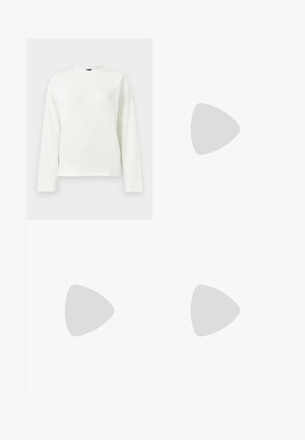 Hvid langærmet t-shirt lavet af blødt bomuld. Har en rund halsudskæring og en afslappet pasform med lige kant. Ingen synlige logoer eller mønstre.; Beige linned brede bukser med elastisk talje og snøre. Stof har en struktureret overflade, der giver et let og luftigt udseende.; Mintgrøn sweatshirt, denimshorts og olivengrønne slip-on sko. Sidder på et lyseget skab mod en struktureret grå væg.; Skildpaddemønstrede solbriller med rektangulær form, grønfarvede linser og mønstrede acetatstel. Har metaldetaljer nær linserne.