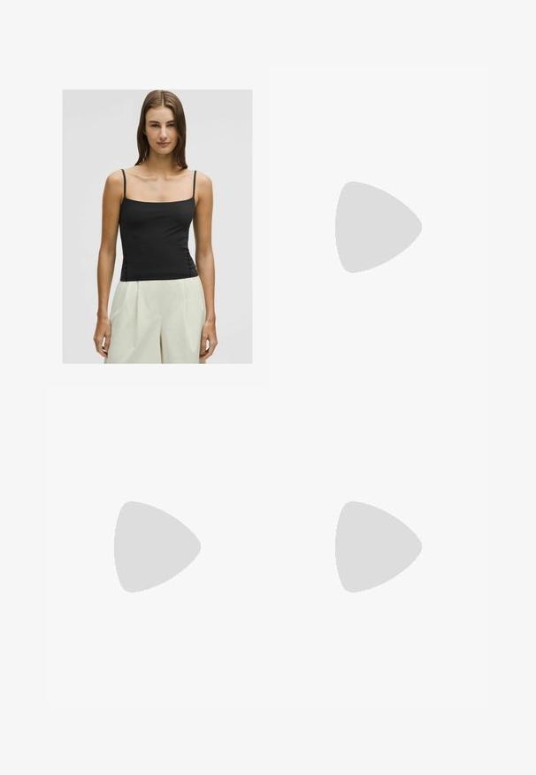 Black spaghetti strap top with a square neckline and fitted silhouette, made from smooth, lightweight fabric. Paired with pale, wide-leg trousers.; White athletic skirt with a flared design, elastic waistband, and built-in shorts. Features a small black Nike logo on the bottom right.; Derimod T-bar sandals - black; Black sunglasses with oval lenses, glossy plastic frame, and slender arms. Features Ray-Ban logo in white on the side.