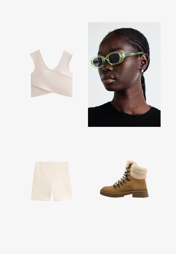 Mjuk, beige bralette med V-ringning, breda remmar och en inslagningdesign. Tillverkad av stretchigt material med släta, minimala sömmar.; Beiga shorts med en hög, strukturerad midja. Tillverkade av ett mjukt, lätt tyg. Har en ren och enkel design utan mönster eller dekorationer.; Bruna mocka vandringskängor med fuskpälskrage, nätfoder, svarta snören och metallöglor. Tjock gummisula med mönster för grepp.; Gröna glasögon med en smal, rektangulär båge och mörka linser; texturerade grå skalmar med varumärke. Slät hud och en svart skjorta.; Hobo-väska i mjuk beige mocka med en avslappnad form, bred axelrem och handsydd sömdetalj längs framsidan.