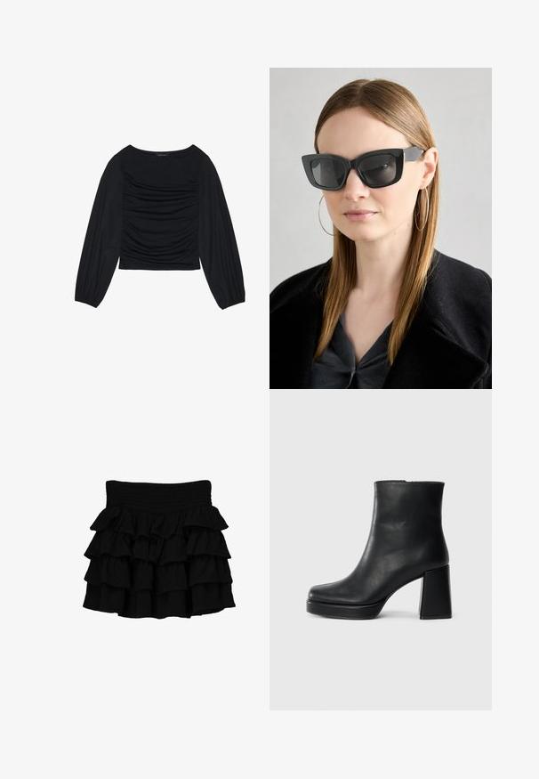 Svart långärmad topp med ruched detalj framtill och vid handleden, tillverkad av mjukt, stretchigt material med en båthals.; Svart rynkad kjol med en smockad midja, tillverkad av ett mjukt material med lager av fallande volanger för extra textur.; Svart läderankelboot med blockklack och platåsula, sedd från sidan på en enkel vit bakgrund.; Svarta katterformade solglasögon med mörka linser, tjocka bågar och subtila detaljer. Bärs tillsammans med en svart kappa och en grå topp, med långt rakt hår.