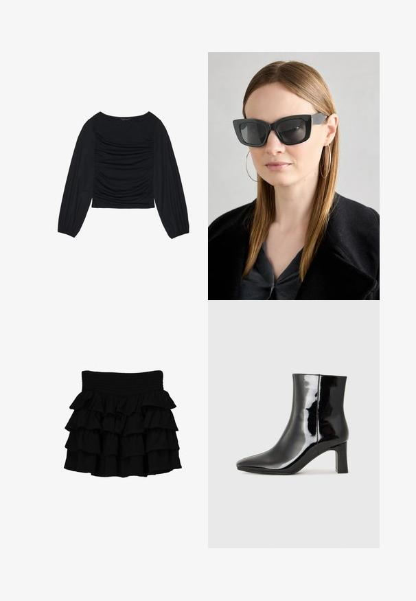 Černý top s dlouhým rukávem, který má na přední straně a zápěstích nařasený materiál. Je vyroben z měkkého, elastického materiálu a má lodní výstřih.; Černá volánková sukně s nařaseným pasem, vyrobená z měkké tkaniny s vrstvami kaskádových volánů pro zvýšení textury.; Černé lakované kotníkové boty s špičatou špičkou a středně vysokým blokovým podpatkem. Hladká textura a minimalistický design.; Černé sluneční brýle ve stylu kočičího oka s tmavými skly, silnými rámy a jemnými detaily. Nosené s černým kabátem a šedým topem, s dlouhými rovnými vlasy.