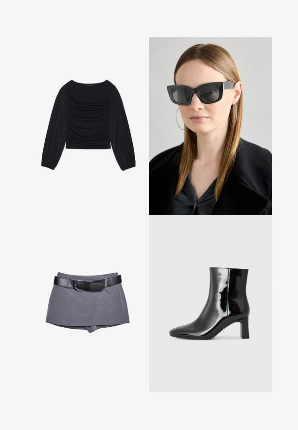 Top noir à manches longues présentant un détail de tissu froncé à l'avant et aux poignets, fabriqué en matière douce et extensible avec un col bateau.; Shorts en tissu gris avec une taille ajustée, dotés d'une ceinture en cuir noir et d'une boucle. Texture lisse, design ajusté et coupe droite.; Bottines en cuir verni noir avec un bout pointu et un talon block de hauteur moyenne. Texture lisse et design minimaliste.; Des lunettes de soleil en forme de chat noir avec des verres foncés, des montures épaisses et des accents subtils. Portées avec un manteau noir et un haut gris, avec des cheveux longs et raides.
