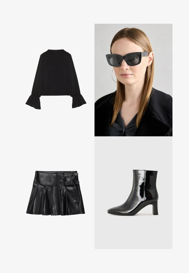 Zwarte langemouwen top met uitlopende manchetten, een zachte textuur en een relaxed fit, met een eenvoudige ronde halslijn.; Zwart leren rok met plooien, brede tailleband en twee gespaccents aan de zijkant. Glad textuur met een glanzende afwerking.; Zwarte gepolijste leren enkellaars met een spitse neus en een blokhak van gemiddelde hoogte. Glad textuur en minimalistisch ontwerp.; Zwarte cat-eye zonnebril met donkere lenzen, dikke monturen en subtiele accenten. Draagt een zwarte jas en een grijze top, met lang stijl haar.