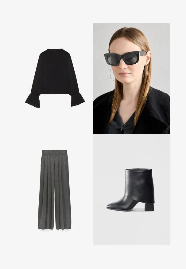 Zwarte langemouwen top met uitlopende manchetten, een zachte textuur en een relaxed fit, met een eenvoudige ronde halslijn.; Grijze geplooide culottes van een gestructureerde stof, met een wijde pijpontwerp en een elastische tailleband voor een ontspannen pasvorm.; Zwarte leren enkellaars met een spitse neus, een zachte textuur en een gestructureerde blokhak. Kenmerkt zich door een hoge, gevouwen kraag.; Zwarte cat-eye zonnebril met donkere lenzen, dikke monturen en subtiele accenten. Draagt een zwarte jas en een grijze top, met lang stijl haar.