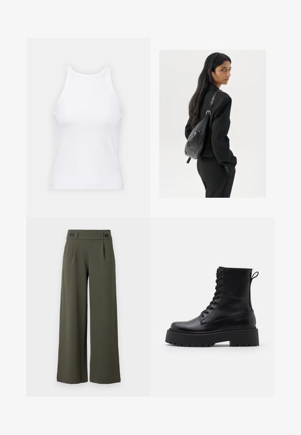 Bela brezrokavna majica iz rebraste tkanine, z zaobljenim izrezom in prilegajočim silhueto, z minimalnimi šivi in brez okraskov.; Hlače s širokimi nogavicami, olivno zelene barve, narejene iz gladkega tkiva; imajo dva črna gumba na pasu in sprednje pliše za dodatne podrobnosti.; Črne usnjene gležnjarje z okroglo konico, vezalnim sprednjim delom in debelim gumijastim podplatom z teksturiranim profilom. Zanka na hrbtni strani.; Ženska z dolgimi temnimi lasmi, oblečena v črn kostim, nosi črno usnjeno torbo čez ramo in se ozira čez ramo proti beli podlagi.