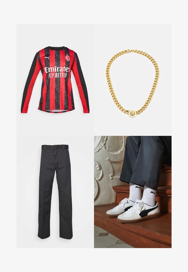 Maillot de football à manches longues rouge et noir avec un design à rayures texturé, doté d'un col rond et d'un logo frontal "Emirates Fly Better."; Pantalons noirs en tissu durable, dotés d'une coupe droite, d'une taille avec passants de ceinture et de coutures pour une texture ajoutée.; Baskets Puma en daim blanc et noir, avec une semelle en caoutchouc marron. Associées à des chaussettes blanches arborant un logo noir, portées avec un pantalon sombre.; Collier en chaîne dorée avec de grands maillons entrelacés, présentant un détail de pendentif circulaire au centre avec un emblème en relief.