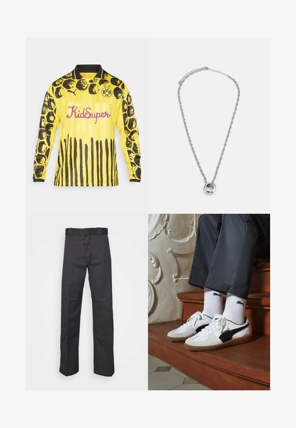 Gelbes Langarm-Fußballtrikot mit schwarzen kreisförmigen und streifenförmigen Mustern, schwarzem Kragen und "KidSuper" in pinker Schrift.; Schwarze Hose aus strapazierfähigem Material, mit geradem Bein, einem Bund mit Gürtelschlaufen und Nähten für zusätzlichen Textur.; Puma-Sneaker aus weißem und schwarzem Wildleder mit einer braunen Gummisohle. Kombiniert mit weißen Socken, die ein schwarzes Logo zeigen, getragen zu dunklen Hosen.; Silberfarbene Metallkette mit einem gedrehten Kettendesign und einem runden Anhänger mit polierter Oberfläche.