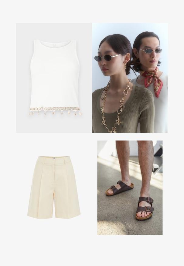 Witte mouwloze crop top met een geribde textuur, voorzien van een decoratieve rand met schelpen en sterrenschelpen aan de onderrand.; Beige geplooide shorts met een op maat gemaakte uitstraling, voorzien van een gladde textuur en zijzakken, geknipt boven de knie voor een ontspannen pasvorm.; Bruine leren sandalen met twee verstelbare gespen, kurken voetbed en gestructureerde rubberen zool, gedragen op blote voeten op een betonnen vloer.; Ronde zonnebrillen met donkere lenzen en dunne zilveren monturen. De ene persoon draagt een gouden ketting, terwijl de andere een rood patroon sjaal heeft.; Geweven rieten tas met bruin lederen accenten, twee handvatten en een afneembare schouderband. Gebogen vorm met een stevige basis.