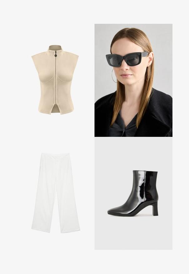 Beige ärmlös jacka med hög krage och central dragkedja. Slät tyg med en strukturerad form och splittat fåll i botten.; Breda byxor i vitt material, med en slät yta, framfickor och en klassisk midja med bälteshål.; Svart lackläder ankelboot med spetsig tå och en medelhög klack. Slät textur och minimalistisk design.; Svarta katterformade solglasögon med mörka linser, tjocka bågar och subtila detaljer. Bärs tillsammans med en svart kappa och en grå topp, med långt rakt hår.