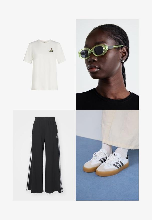 White cotton t-shirt with short sleeves, round neckline, featuring a triangular multicolor logo patch on the left chest.; Black wide-leg sweatpants with an elastic waistband, featuring white side stripes and an embroidered logo on the left thigh.; White sneakers with black stripes and beige suede accents. Feature a textured gum sole and flat white laces, worn with light-colored socks.; Green-tinted sunglasses with a slim, rectangular frame and dark lenses; textured gray arms with branding. Smooth skin and a black shirt.