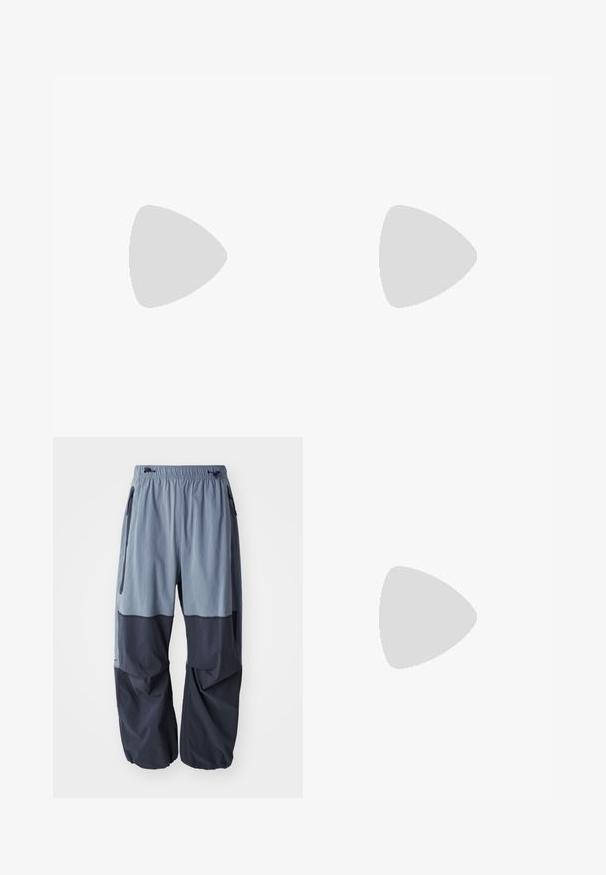 Beige kortärmad T-shirt av bomull med svart text "OFFICIAL USE ONLY" och Nike-logotyp på vänster bröst.; Baggy, tvåtoniga utomhusbyxor med en ljusblå övre del och en mörk marinblå nedre del, med dragsko i midjan och sidofickor.; Svarta träningsskor med blå och silver detaljer, med en texturerad ovandel, en djärv sula och snörningssystem. Positionerade på en blå matta.; Svarta inramade solglasögon med mörkgröna linser. Matt finish, böjd design, med raka bågar och subtil varumärkeslogotyp på sidan.