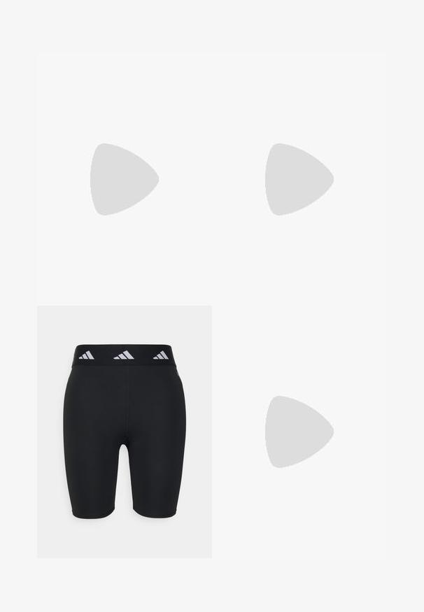 Top sportiv scurt de culoare roșie, cu o textură canalată, având guler rotund, bretele late și detalii cu logo alb.; Pantaloni scurți sport negri, cu un design ajustat, fabricati din material elastic. Prezintă o talie largă neagră cu accente albe de branding.; Pantofi sport negri cu dungi albe, pantaloni scurți verde măsliniu și șosete negre. O funie de sărit este în mâinile persoanei. Fundal neutru.; Ochelari de soare negri cu o finisare mată, lentile dreptunghiulare, curbură ușoară pe bănci, detaliu subtil cu logo și lentile cu tentă fumurie.