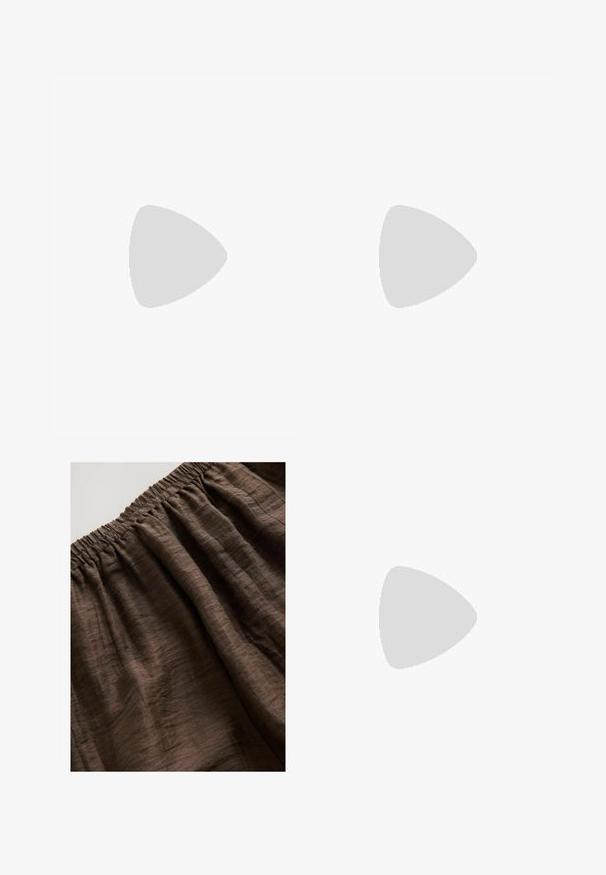 Black crop top with crossed straps, featuring a loose fit, decorative knot at the hem, and a pattern of multicolored squares and dots.; Brown elasticized waistband with textured fabric, featuring soft, wrinkled folds and a rich, earthy tone. Suitable for casual wear.; Black patent leather slingback pump with pointed toe, open side cutouts, slim heel, and adjustable ankle strap.; Black leather handbag with a curved shape, detachable strap, and gold hardware. The bag features a flap with a buckle detail.