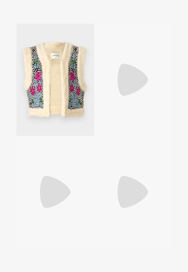 Fleece vest in cream with floral embroidery in pink, blue, and green on black fabric. Features open front and textured finish.; White sleeveless tank top made of ribbed fabric, featuring a rounded neckline and a fitted silhouette, with minimal seams and no embellishments.; Flared blue denim jeans with a high waist, five pockets, and contrast stitching; smooth texture and classic wash.; Brown suede sneakers with white accents and laces. Rubber gum sole. Worn with white socks featuring black stripes. Green textured flooring.
