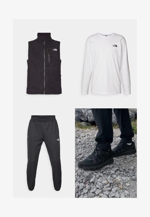 Czarny polarowy kamizel z wysokim kołnierzem, zapięciem na zamek z przodu oraz dwoma bocznymi kieszeniami na zamek. Posiada kieszeń na zamek na piersi i logo z przodu.; Biała koszulka z długim rękawem wykonana z bawełny, z okrągłym dekoltem. Posiada małe czarne logo na piersi. Gładka faktura, regularny krój.; Czarne dresy z elastycznym paskiem w talii, zwężanym krojem, elastycznymi mankietami i małym białym logo na lewej udzie, wykonane z gładkiego materiału.; Czarne buty outdoorowe wykonane z siateczki i materiału syntetycznego, z fakturowaną cholewką, zabezpieczonym systemem sznurowania i solidną podeszwą, na skalistym terenie.